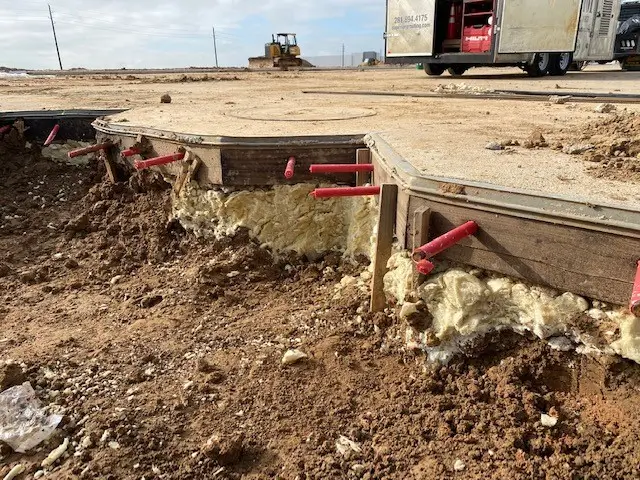 Construction of round concrete formwork at a building site